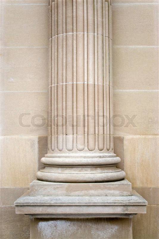 An old stone column on the exterior of a building, stock photo