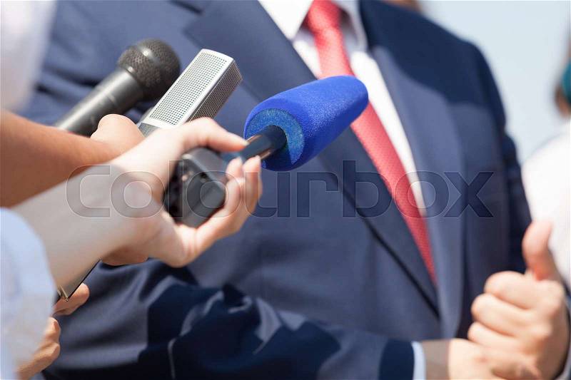 Media interview with business person, politician or spokesman, stock photo