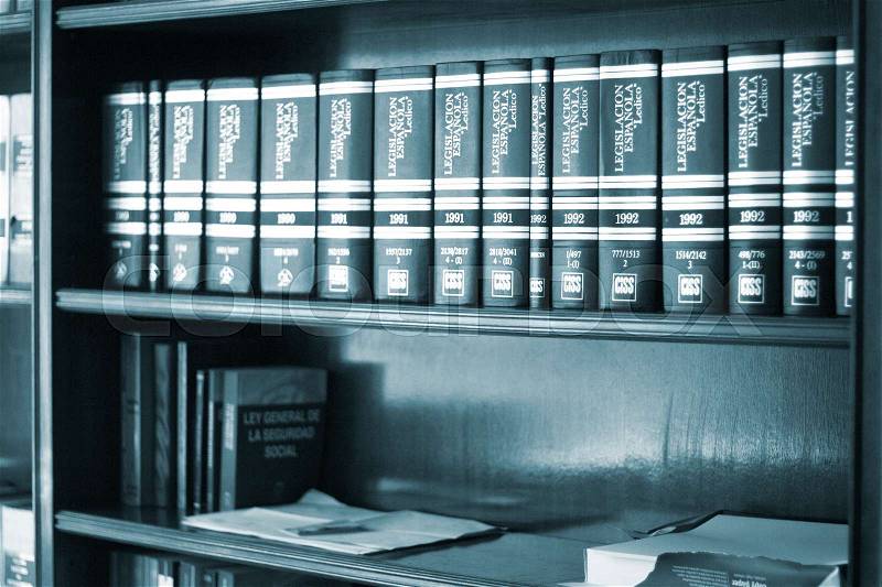 Old legal books law reports on shelves of law offices of attorneys and lawyers in judicial reference library, stock photo
