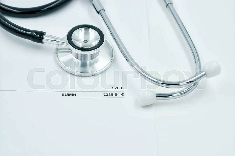 Stethoscope and bill of health cost on vintage filter - can use to display or montage on product, stock photo