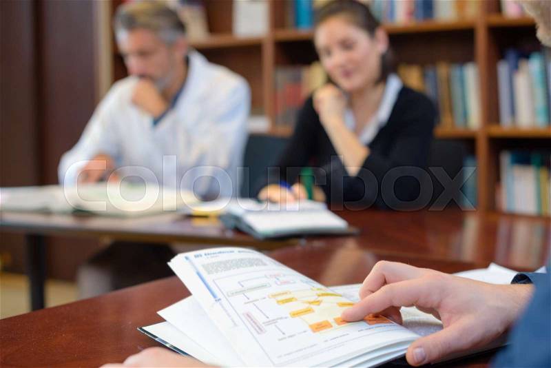 People studying in library, stock photo