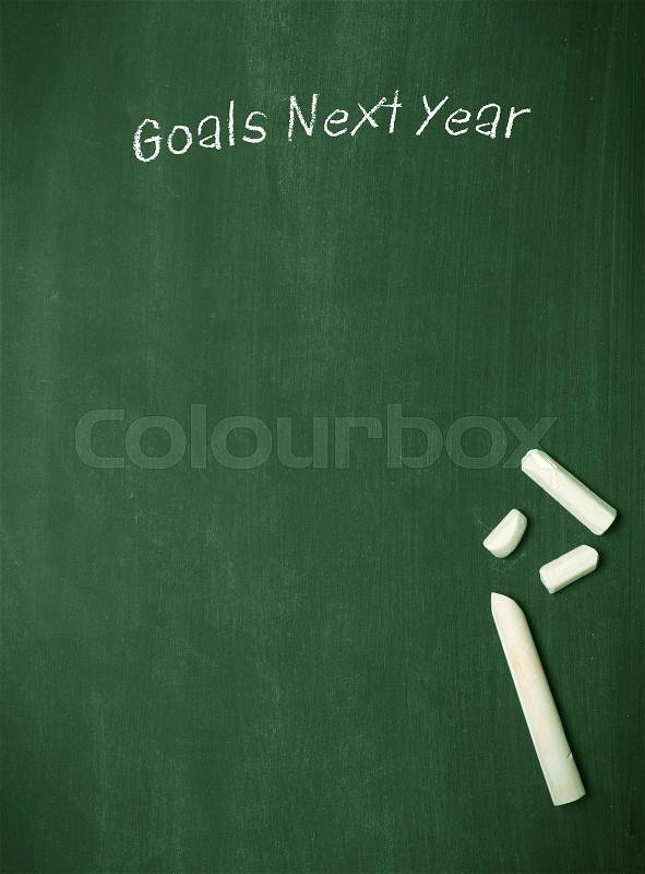 Goals Next Year on a blackboard with chalk and space for text or image, stock photo