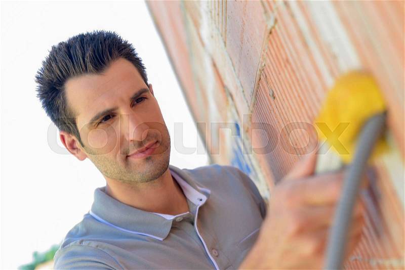 Electrician wiring a house, stock photo