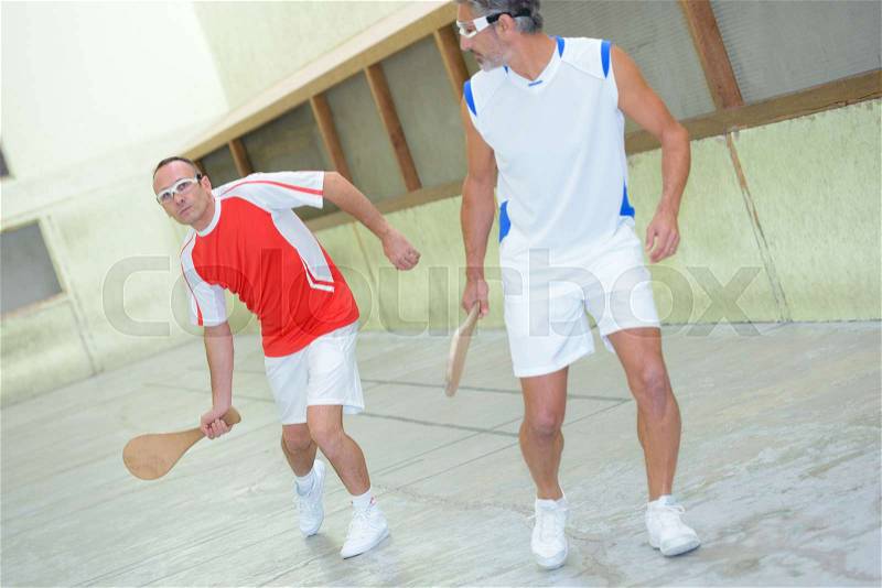 Men playing racket sport, stock photo