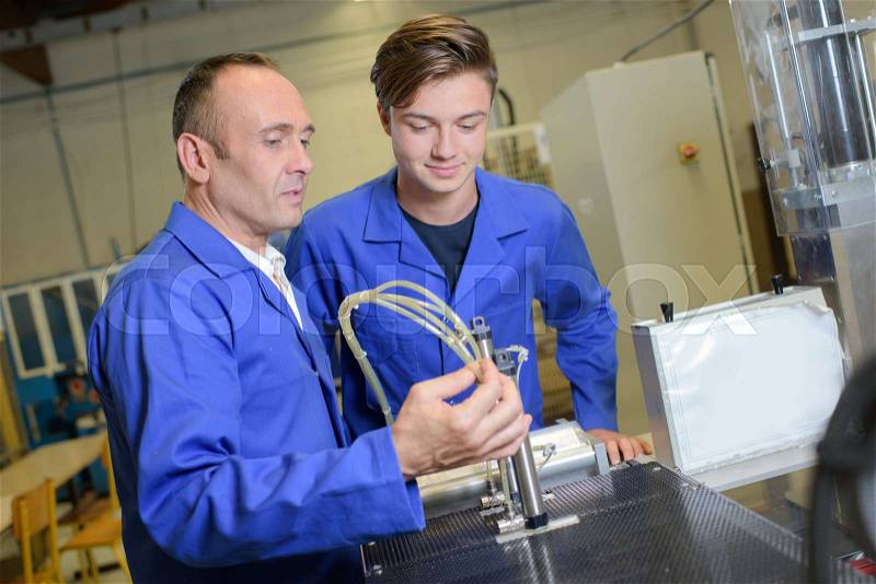 Professor and student in vocational college, stock photo
