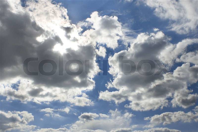 Heavens Sun behind the cloud, warm summer day, stock photo