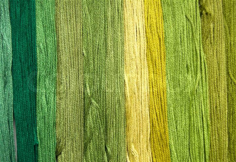 Yarn background in shades of green, stock photo
