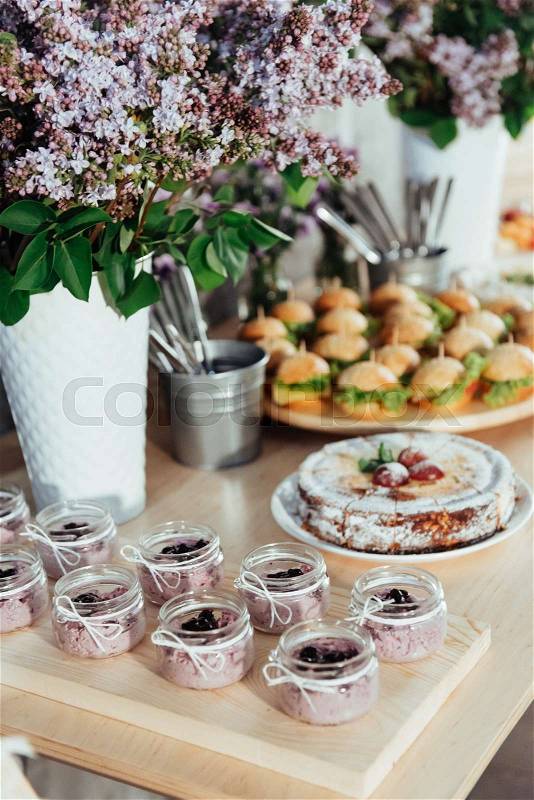 Canapes and drinks and desserts on the buffet table. Buffet reception, stock photo