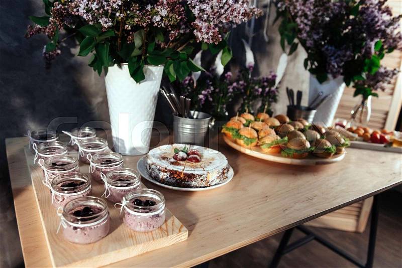 Canapes and drinks and desserts on the buffet table. Buffet reception, stock photo