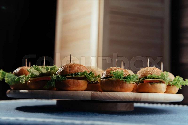 Hamburger on wood table. Home made burger. Fastfood meal. Pub burger. Delicious Hamburger. Gourmet hamburger. , stock photo