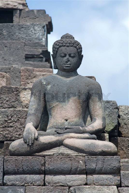 Buddha statue in Borobudur temple near Yogyakarta on Java island, Indonesia, stock photo
