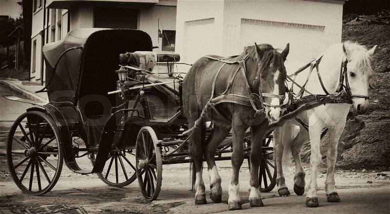 Cart with two horses, retro style, in sepia, stock photo