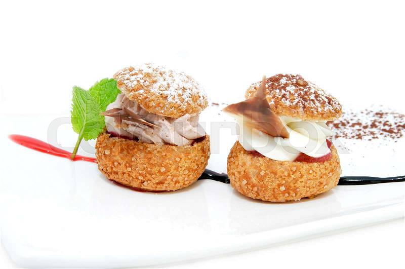 Profiteroles with vanilla ice cream decorated with chocolate mint, stock photo