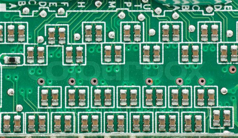 Green circuit board with components, stock photo