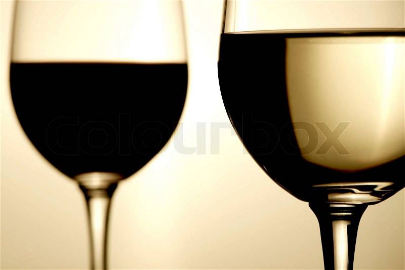 Glasses of red and white wine, stock photo