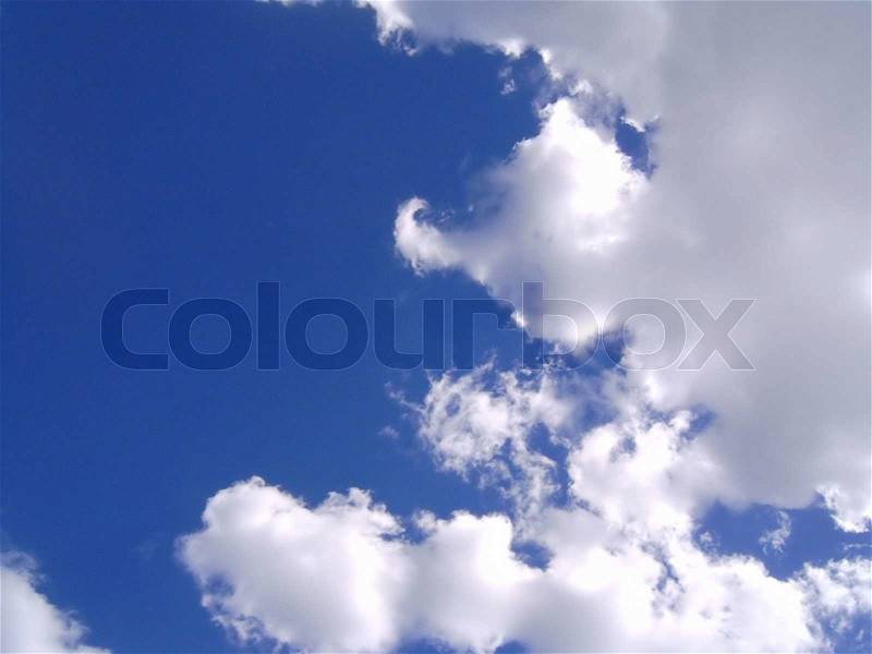 A beautiful bunch of clouds rolling by at the beach, stock photo