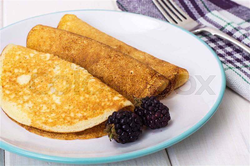 Pancake thin fried with blackberry. Studio Photo, stock photo