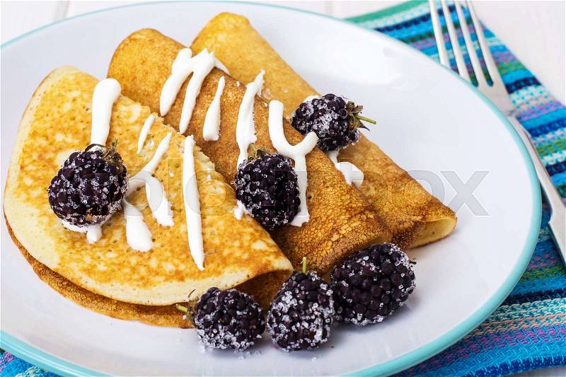 Pancake thin fried with blackberry. Studio Photo, stock photo