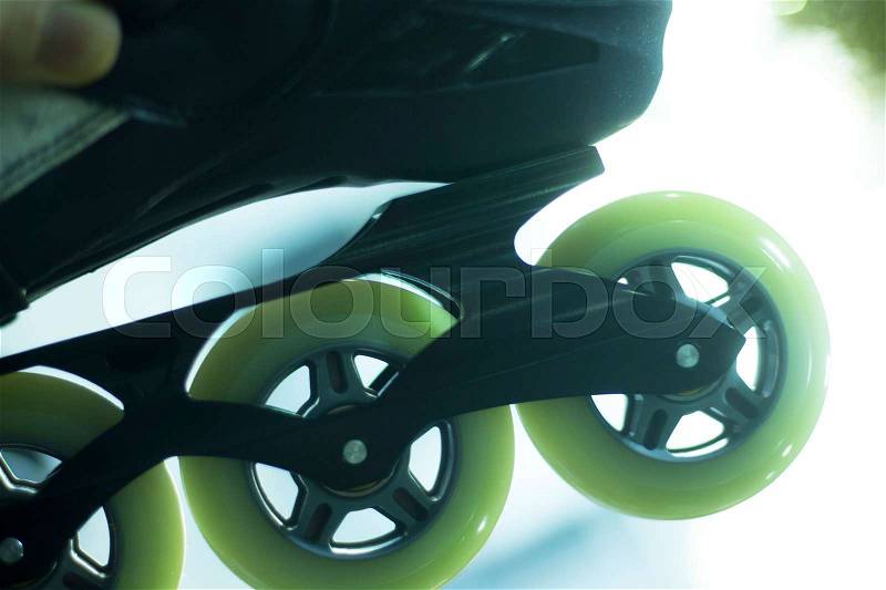 Freestyle inline skates boots and wheels in retail store shop window for free, urban, slalom, fitness and recreational skating, stock photo