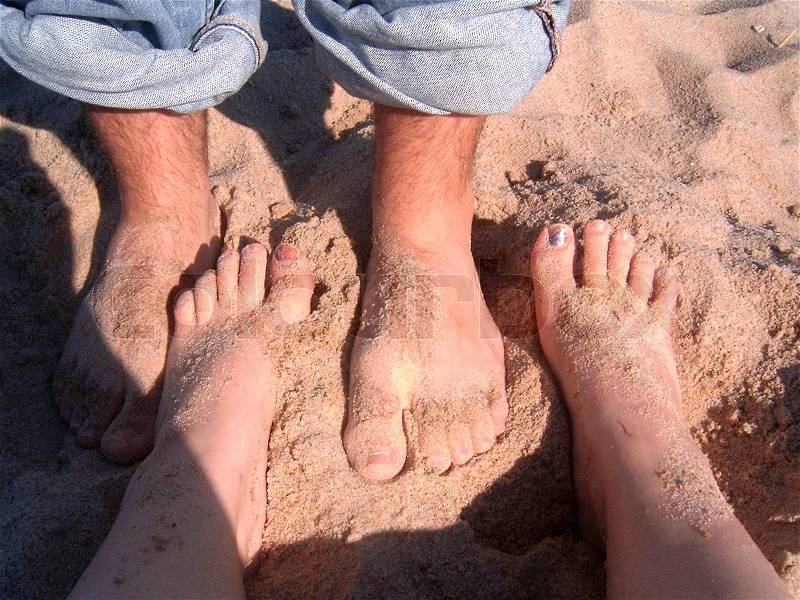 Some sandy feet alternated, stock photo