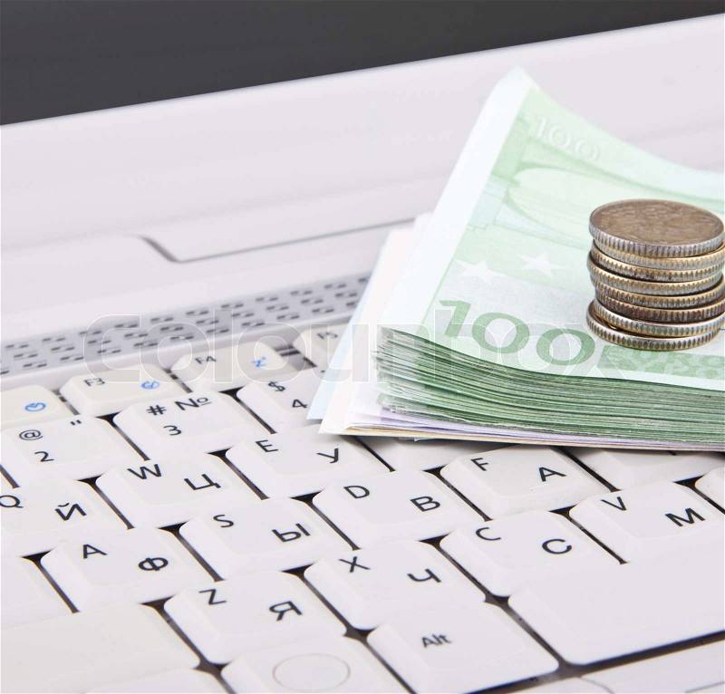 Money on keyboard, stock photo