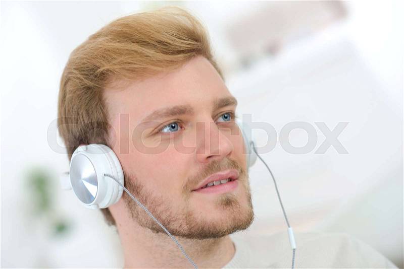 Man listening to music, stock photo