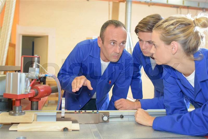 Professor and students in vocational college, stock photo