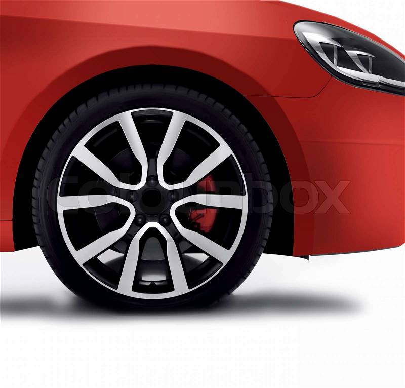 Cherry red car front detail with big light-alloy wheel, stock photo