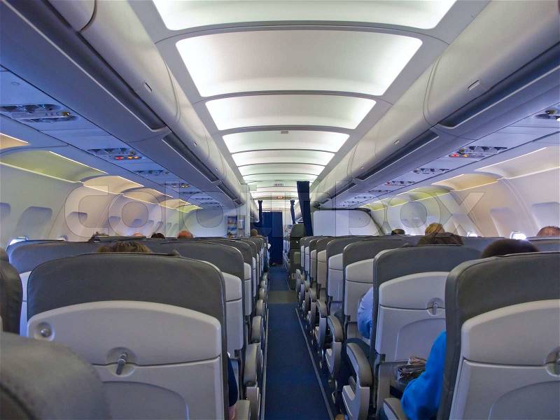 Aircraft cabin after take off, stock photo