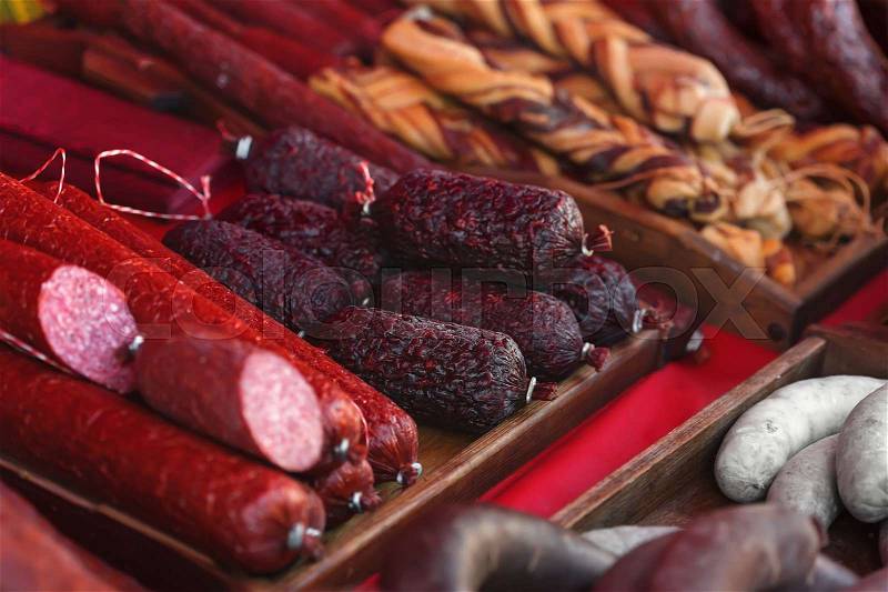 Sale of homemade sausages, salami and other meat products, stock photo
