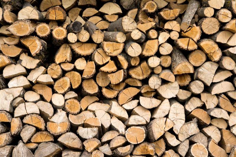 Wall firewood , Background of dry chopped firewood logs in a pile, stock photo