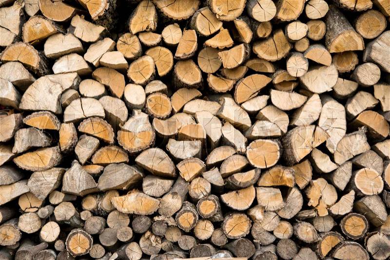 Wall firewood , Background of dry chopped firewood logs in a pile, stock photo