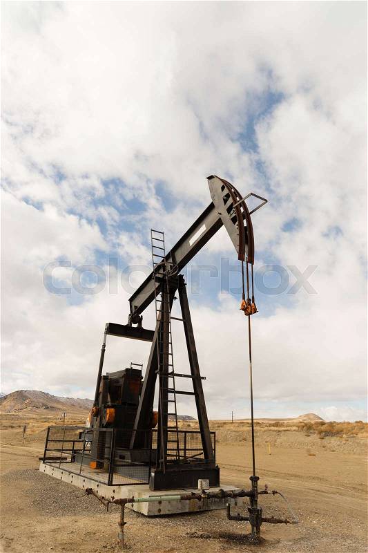Wyoming Industrial Oil Pump Jack Fracking Crude Extraction Machine, stock photo