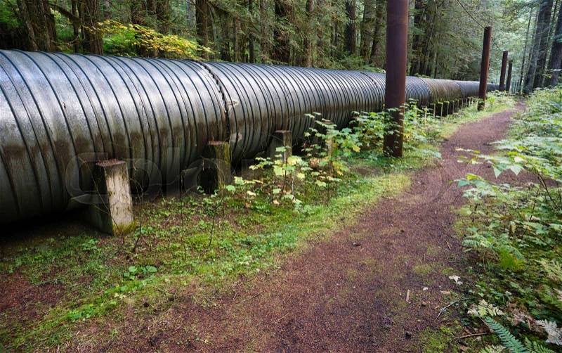 A pipeline carries water to the generator room for electricity, stock photo