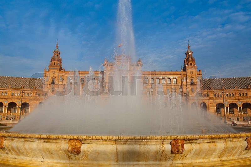 Fountain on Plaza de Espana - Spanish Square in Seville, Andalusia, Spain. The Plaza de España is a plaza in the Parque de María Luisa, in Seville, Spain, built in 1928 for the Ibero-American Exposition of 1929, stock photo
