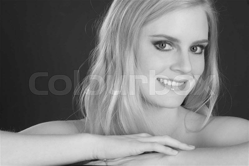 Beautiful Happy Blond Woman Smiling Big in Head and Shoulders Beauty Pose, stock photo