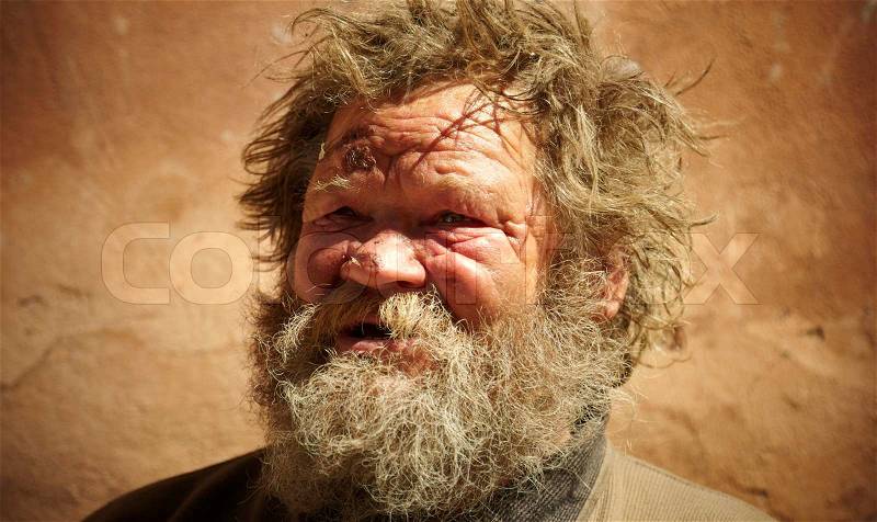 Homeless man talking about hard life, special toned photo f/x, focus point on eye, stock photo