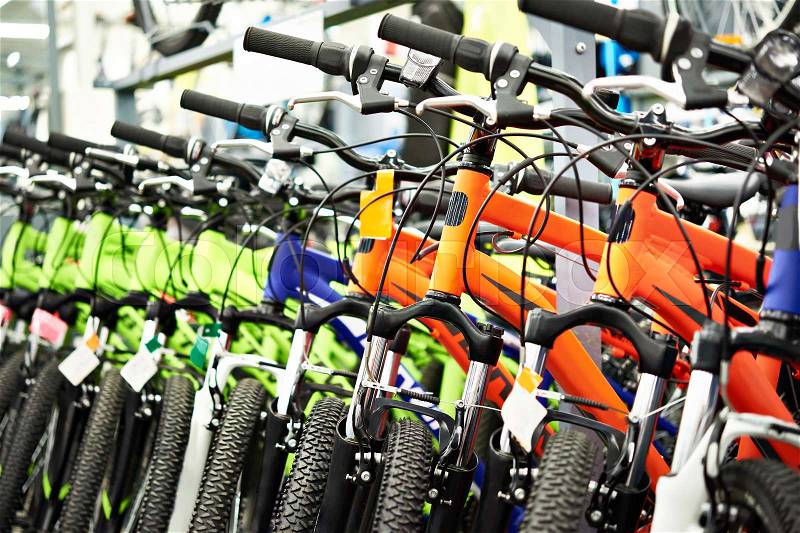 Modern mountain bikes in sports shop, stock photo