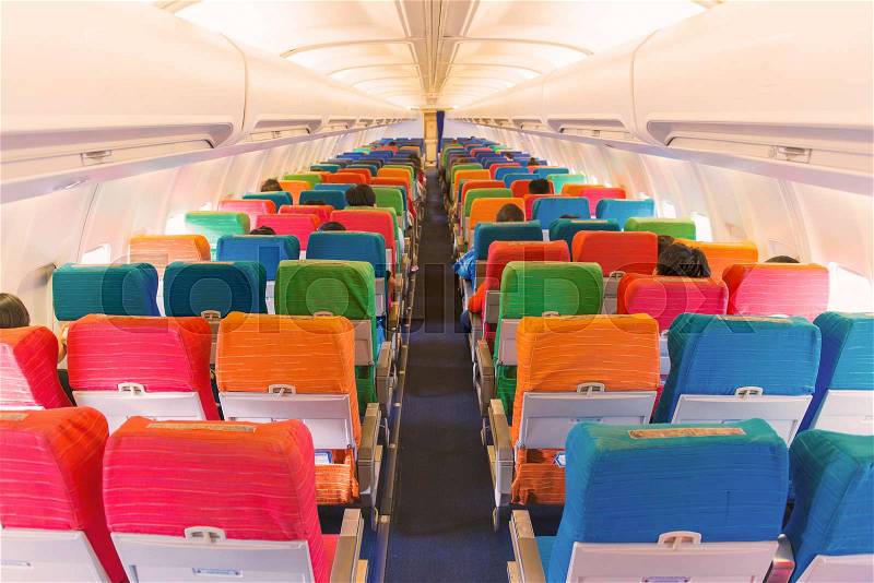 Airplane seat with in cabin of huge aircraft, stock photo