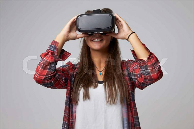 Studio Portrait Of Video Game Designer Wearing VR Headset, stock photo