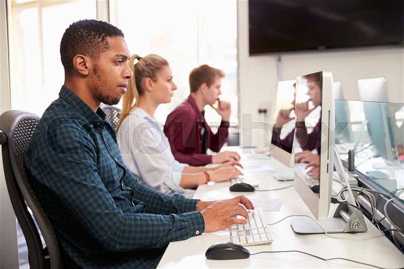 Group Of University Students Using Online Resources, stock photo