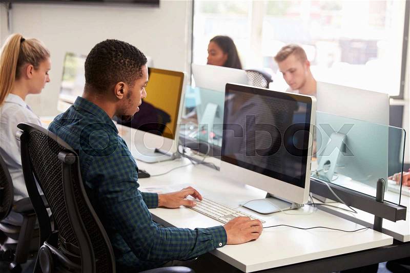 Group Of University Students Using Online Resources, stock photo