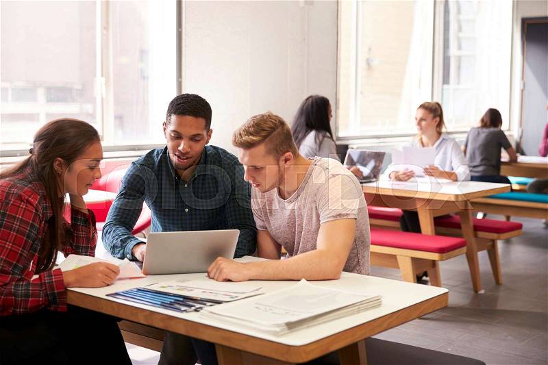 Group Of University Students Working In Study Room, stock photo