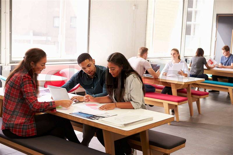 Group Of University Students Working In Study Room, stock photo