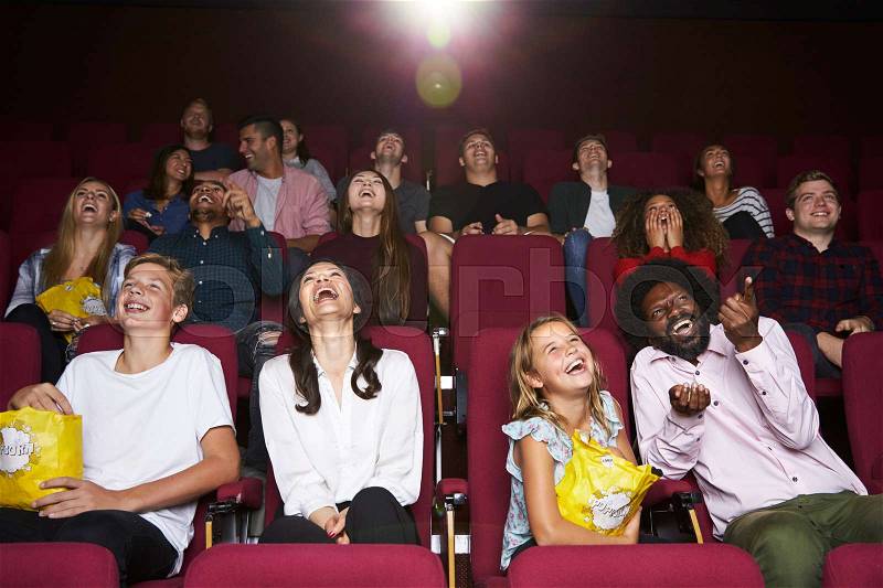 Audience In Cinema Watching Comedy Film, stock photo