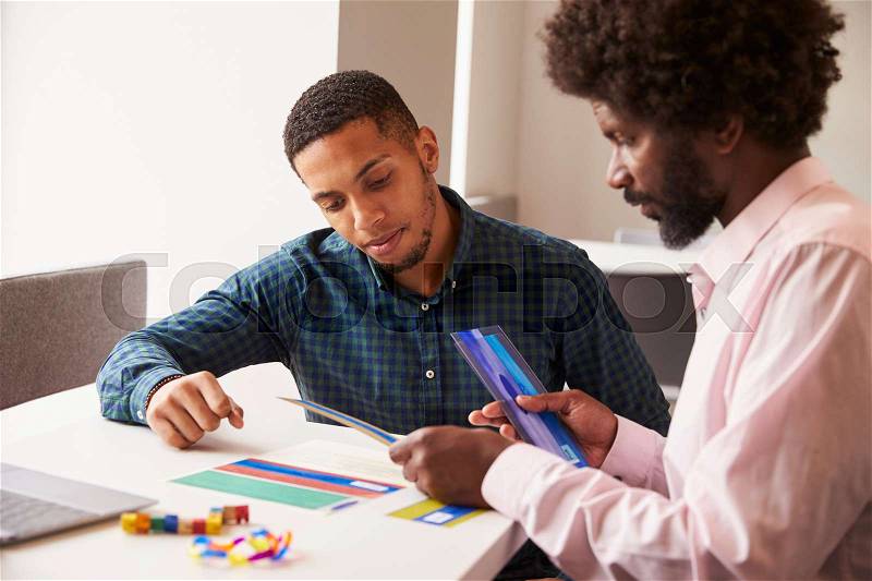 Tutor Using Learning Aids To Help Student With Dyslexia, stock photo