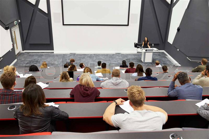 Lecture at university lecture theatre, audience POV, stock photo