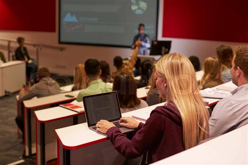 Adult student using laptop computer at a university lecture, stock photo