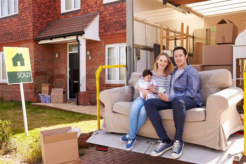 Family With Sofa On Tail Lift Of Removal Truck Moving Home, stock photo