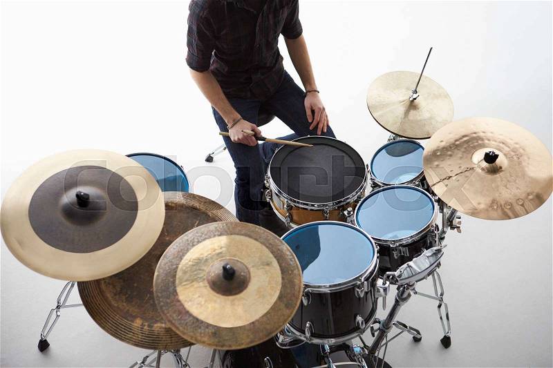 Overhead Shot Of Drummer Playing Drum Kit In Studio, stock photo